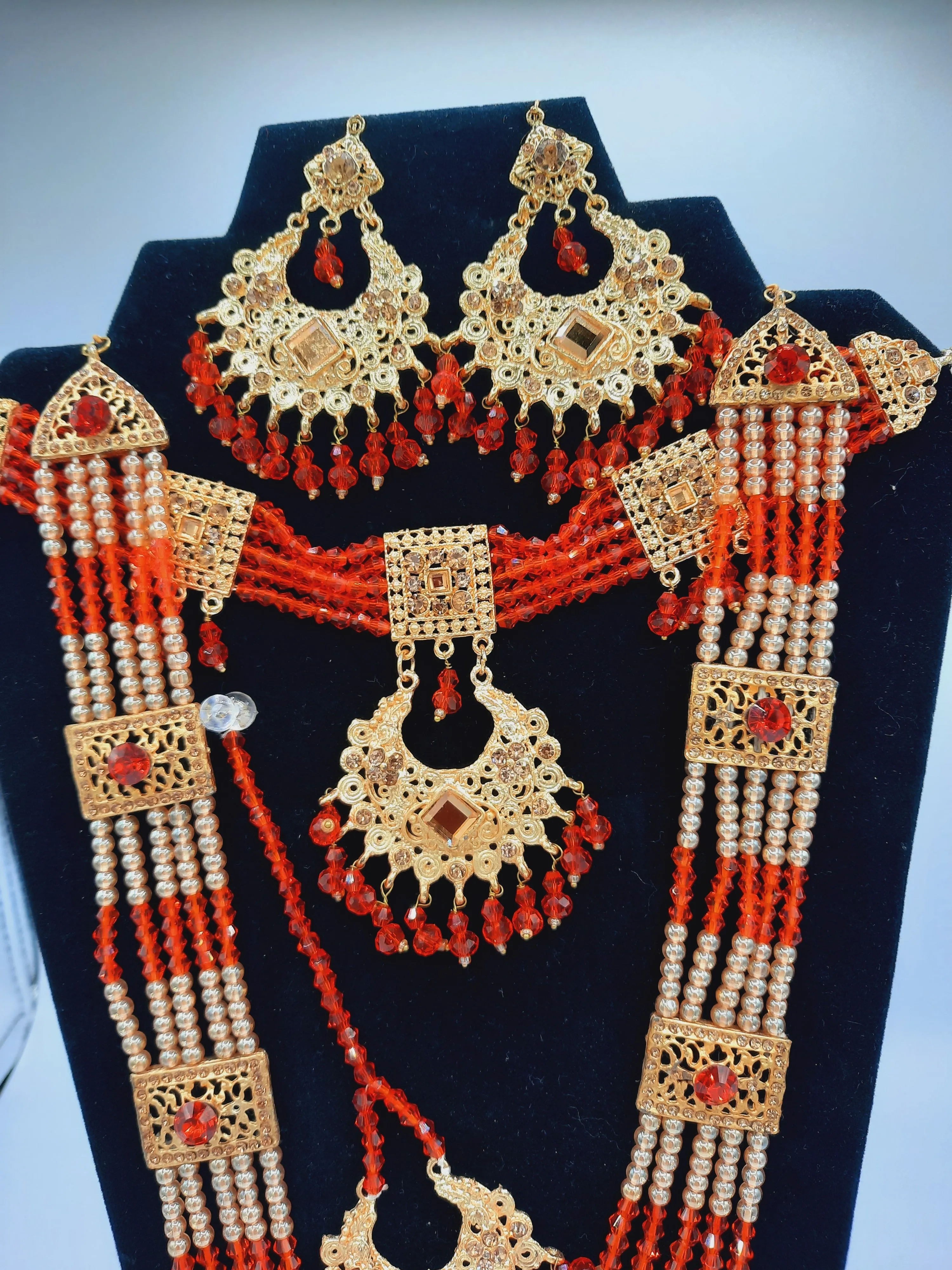 Red guluband choker with earrings and teeka