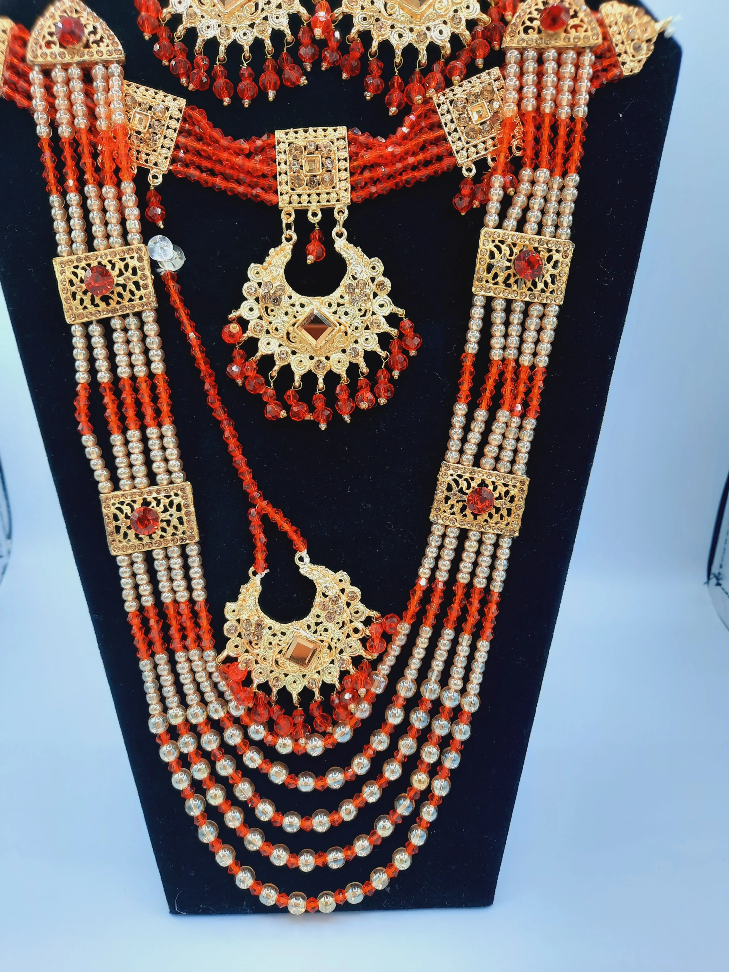 Red guluband choker with earrings and teeka